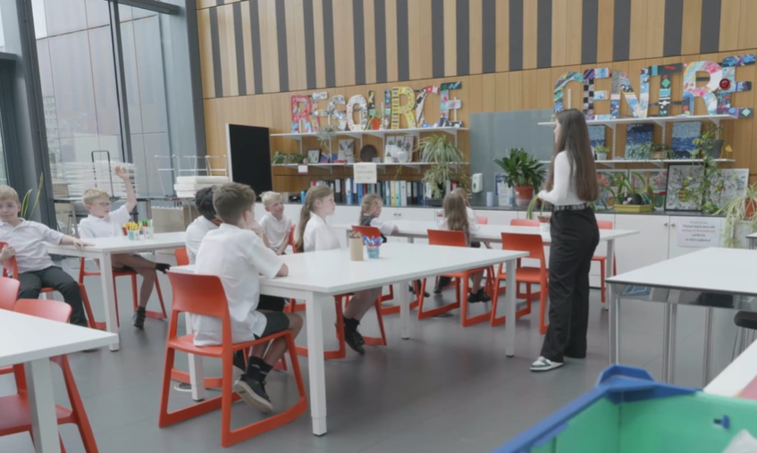 Primary school pupils taking part in a CHAMP School Wellbeing Project activity, sorting green leaf-shaped cards